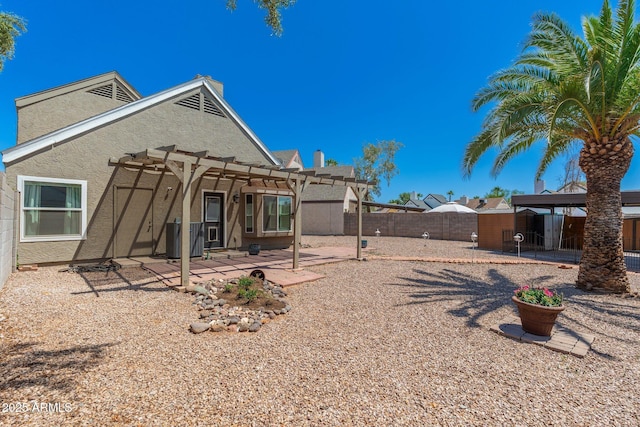 20818 N 21st Dr, Phoenix, AZ 85027 - back of house with a fenced backyard, a pergola, stucco siding, and a patio