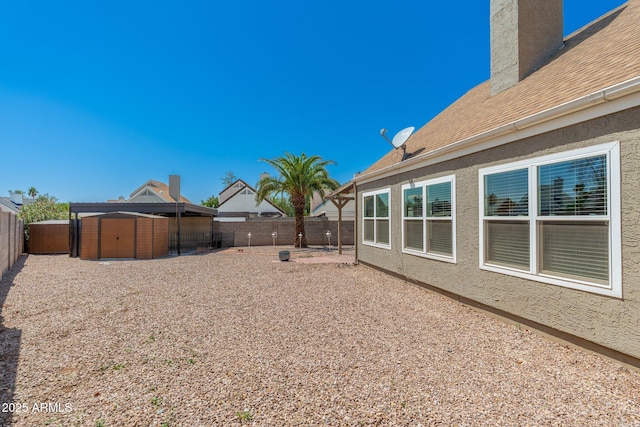 20818 N 21st Dr, Phoenix, AZ 85027 - view of yard featuring a storage shed, an outbuilding, a fenced backyard, and a patio area