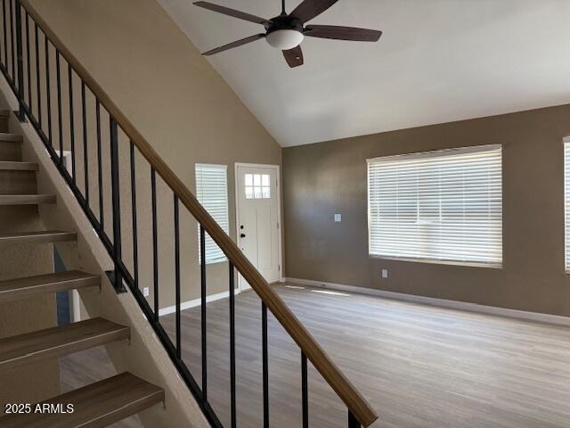 20818 N 21st Dr, Phoenix, AZ 85027 - stairs with high vaulted ceiling, ceiling fan, baseboards, and wood finished floors