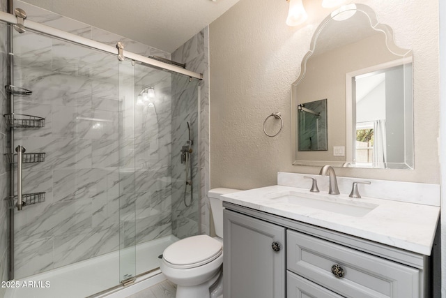 20818 N 21st Dr, Phoenix, AZ 85027 - bathroom featuring vanity, a textured wall, toilet, and a marble finish shower