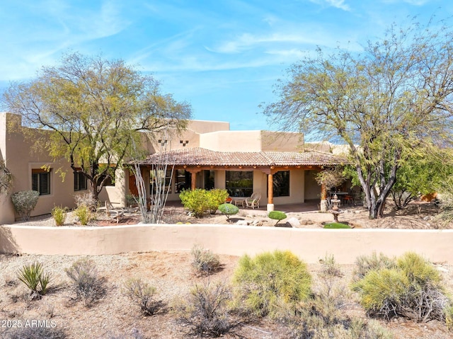 exterior space featuring stucco siding and a patio