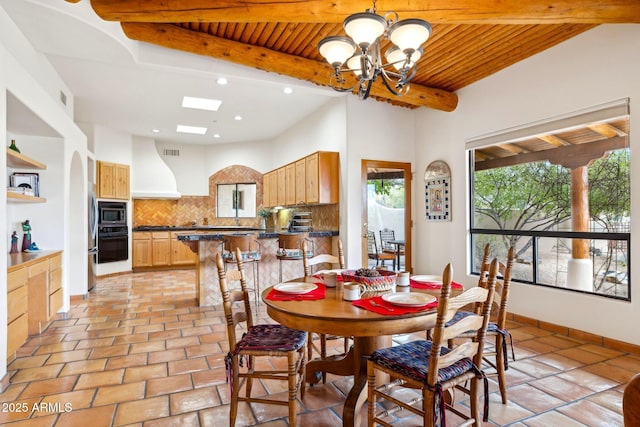 dining room featuring wooden ceiling, beamed ceiling, baseboards, and a chandelier