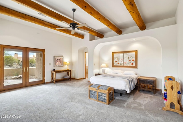 bedroom featuring visible vents, arched walkways, carpet flooring, and access to outside