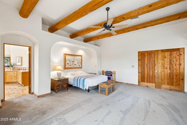 bedroom with baseboards, visible vents, light carpet, and beam ceiling