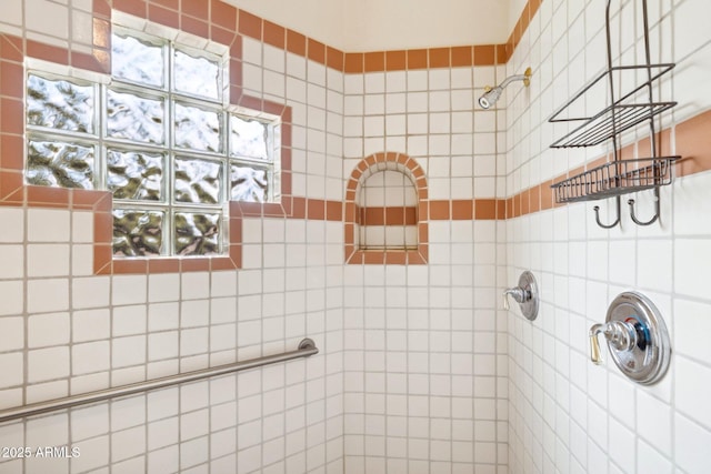 full bath featuring tiled shower