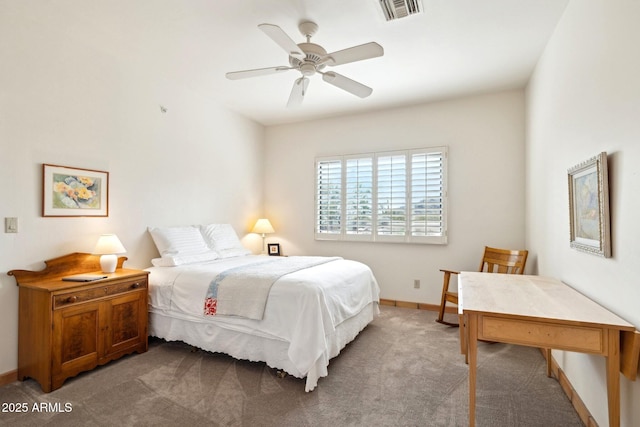 bedroom featuring a ceiling fan, baseboards, visible vents, and light carpet