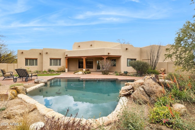 view of swimming pool with a patio, fence, and a fenced in pool