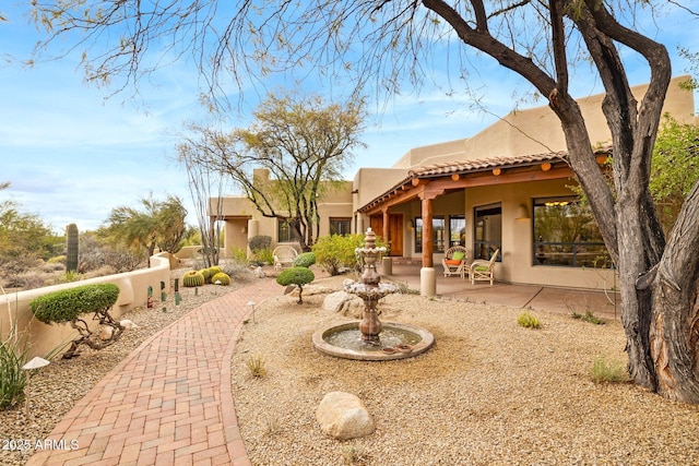 exterior space featuring a patio and fence