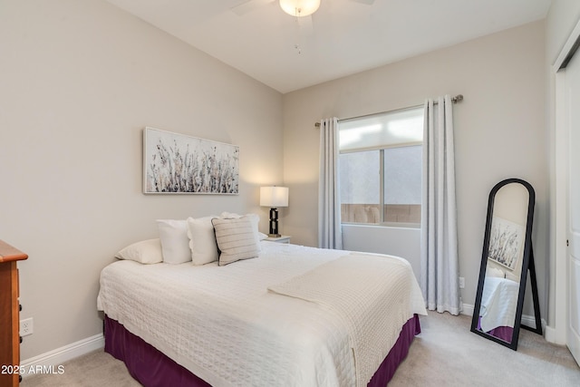 bedroom with light colored carpet and ceiling fan