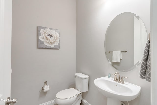 bathroom with sink and toilet