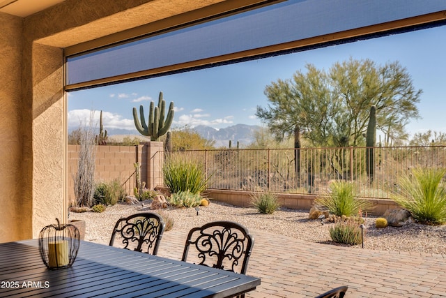 view of patio / terrace featuring a mountain view