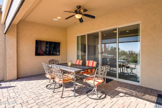 view of patio featuring ceiling fan