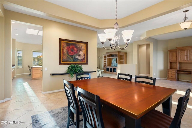 dining space with a chandelier and light tile patterned flooring