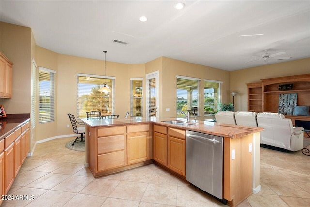 kitchen with pendant lighting, dishwasher, light brown cabinets, sink, and light tile patterned flooring