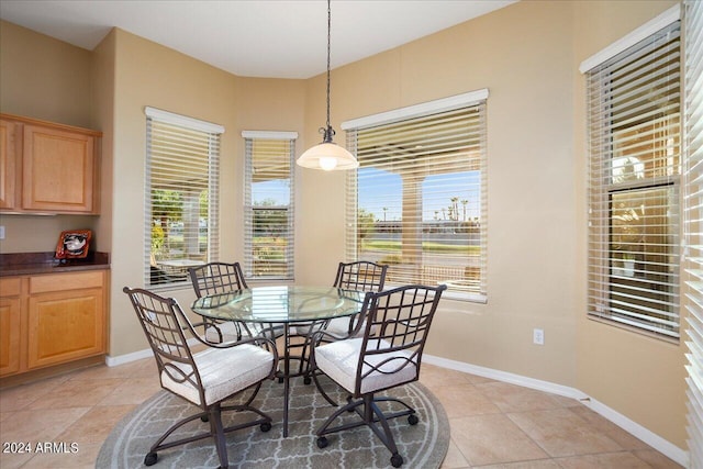 dining area featuring light tile patterned floors