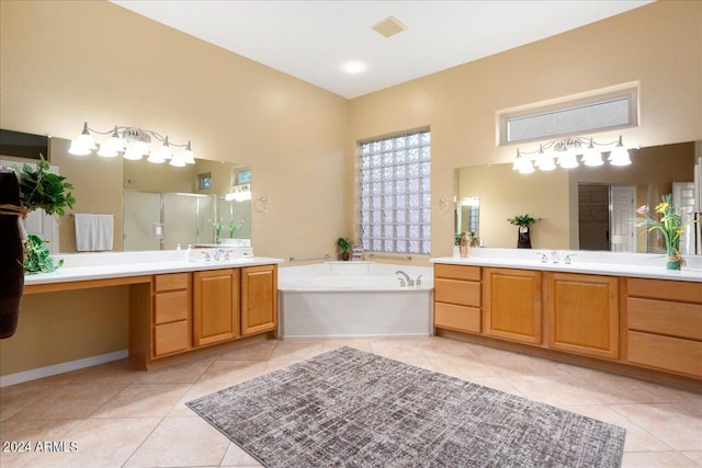 bathroom with plus walk in shower, tile patterned floors, and vanity