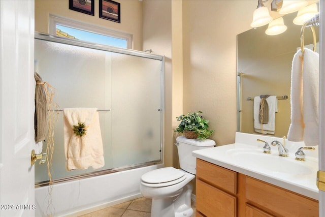 full bathroom with enclosed tub / shower combo, vanity, toilet, and tile patterned flooring