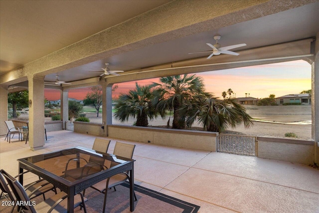 patio terrace at dusk with ceiling fan