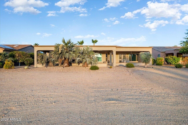 view of front of property with a carport