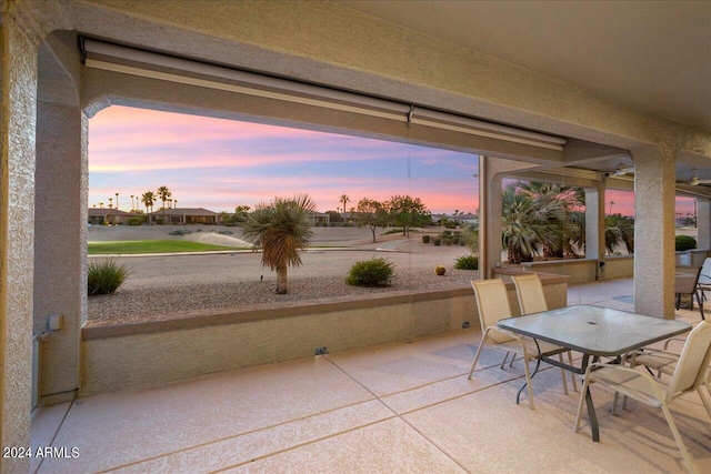 view of patio terrace at dusk