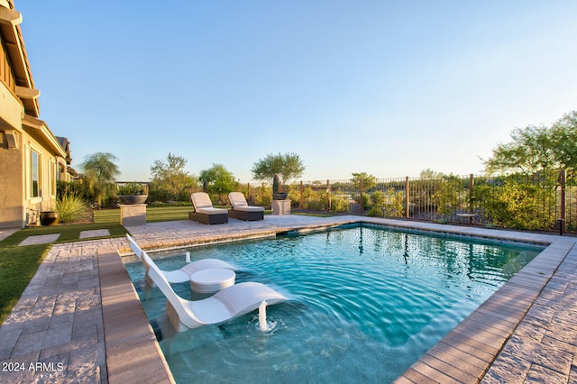 view of swimming pool featuring a patio area