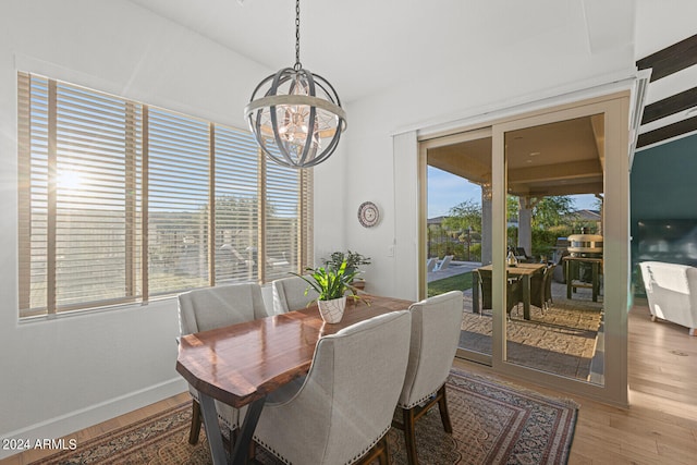 dining room with a chandelier and hardwood / wood-style floors