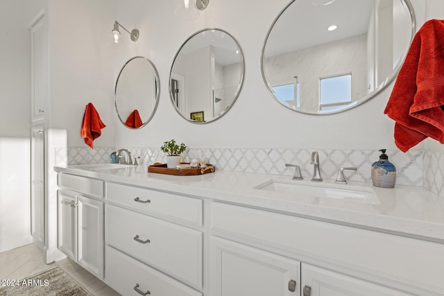 bathroom featuring decorative backsplash and vanity