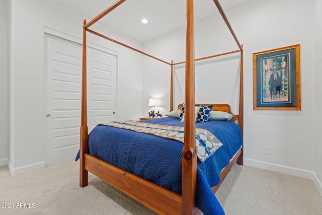 carpeted bedroom with a closet