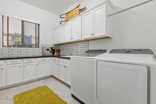 washroom with separate washer and dryer, light tile patterned flooring, and cabinets