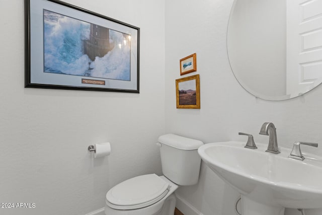 bathroom with sink and toilet