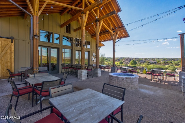 view of patio / terrace featuring a fire pit