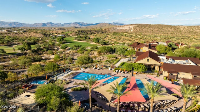 birds eye view of property with a mountain view