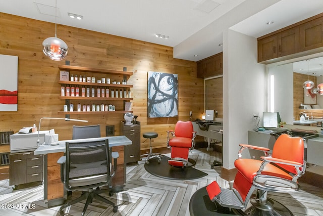 office area featuring wooden walls and light parquet floors