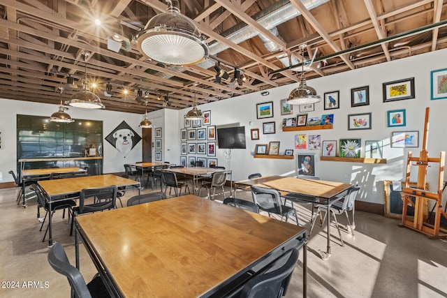 dining space with concrete flooring