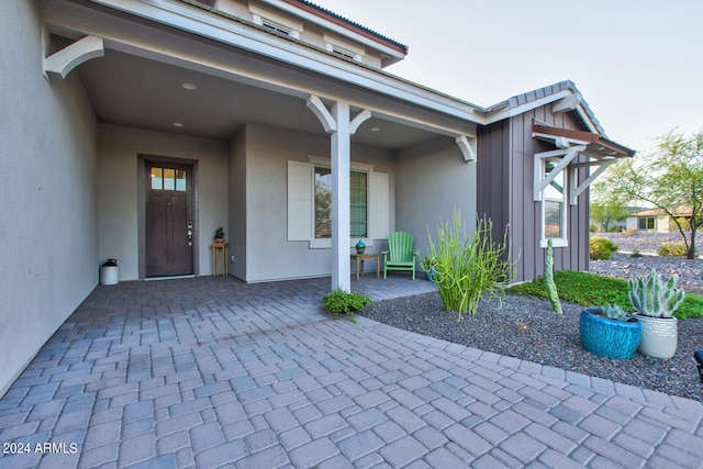 entrance to property with a patio area