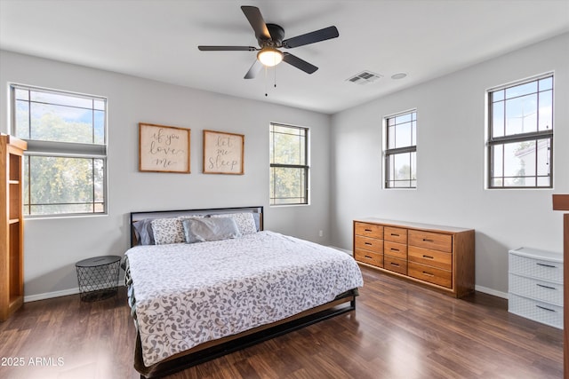 bedroom featuring ceiling fan and dark hardwood / wood-style flooring