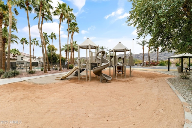 view of jungle gym featuring a mountain view