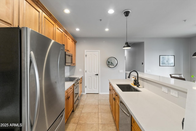 kitchen featuring stainless steel appliances, light tile patterned flooring, hanging light fixtures, and sink