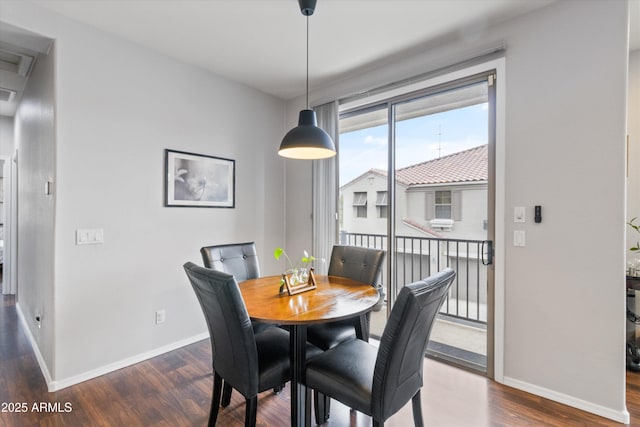 dining area with dark wood-type flooring