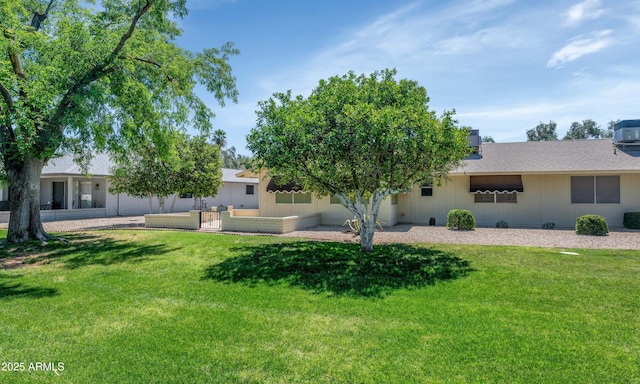 exterior space featuring a yard and fence