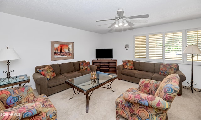 living room featuring ceiling fan and carpet