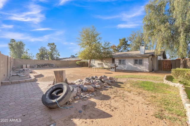 view of yard featuring a fenced backyard and a patio