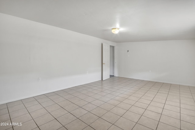 spare room with light tile patterned floors