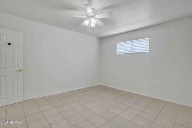 unfurnished room featuring light tile patterned floors and ceiling fan