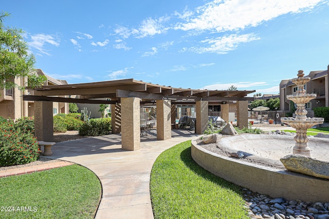 view of home's community featuring a pergola and a patio