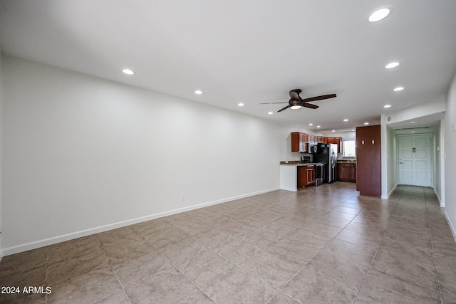 unfurnished living room featuring ceiling fan