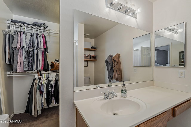 11101 E Abilene Ave, Mesa, AZ 85208 - bathroom featuring vanity and a spacious closet