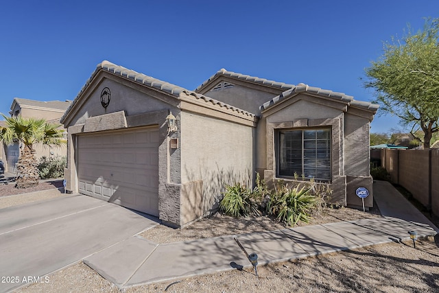 11101 E Abilene Ave, Mesa, AZ 85208 - view of front of house featuring a garage, stucco siding, and driveway