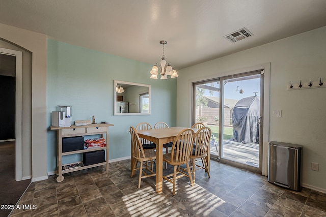 11101 E Abilene Ave, Mesa, AZ 85208 - dining room with a chandelier, stone finish flooring, and arched walkways