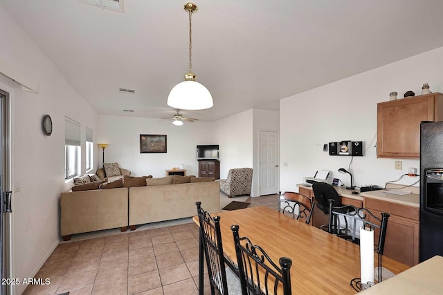 dining area featuring light tile patterned flooring and ceiling fan